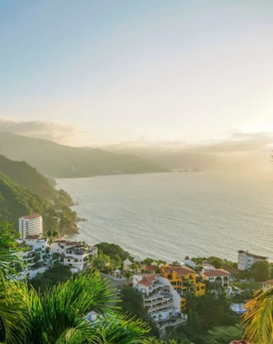 Elevated view of resorts along the mountainous coastline of Puerto Vallarta