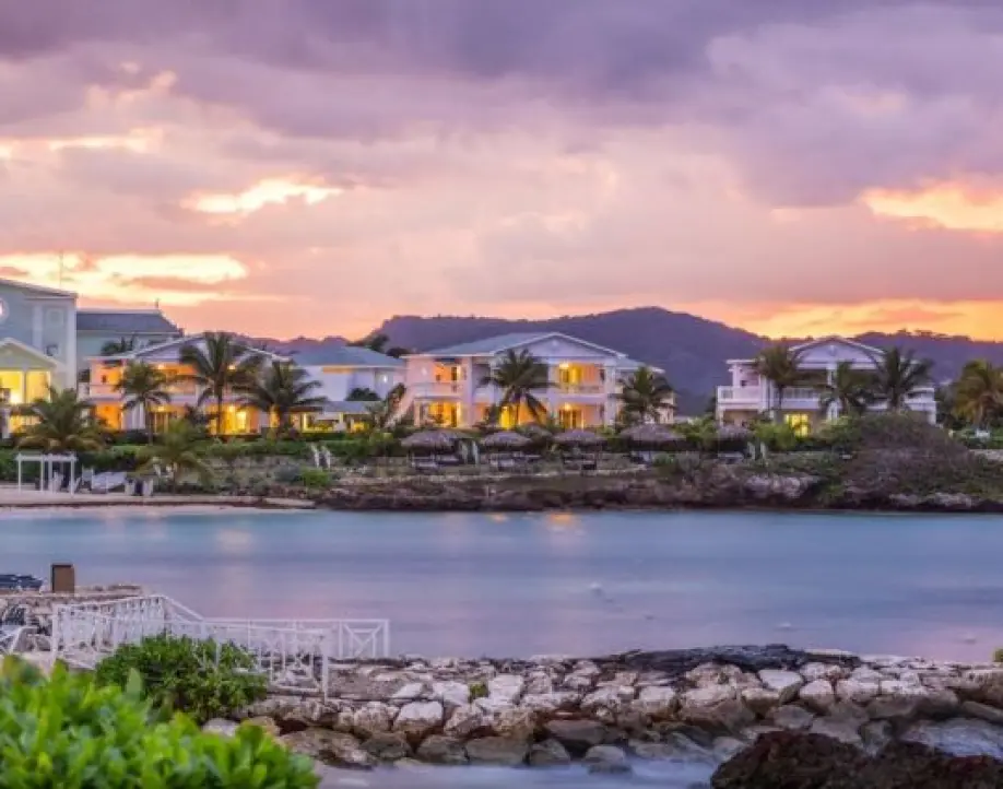 Grand Palladium Jamaica buildings at sunset overlooking the lagoon and beach