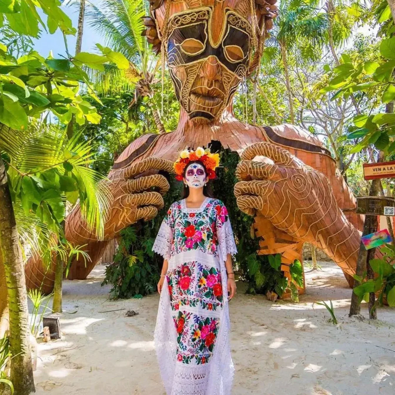 lady is festive attire standing outside ahau tulum
