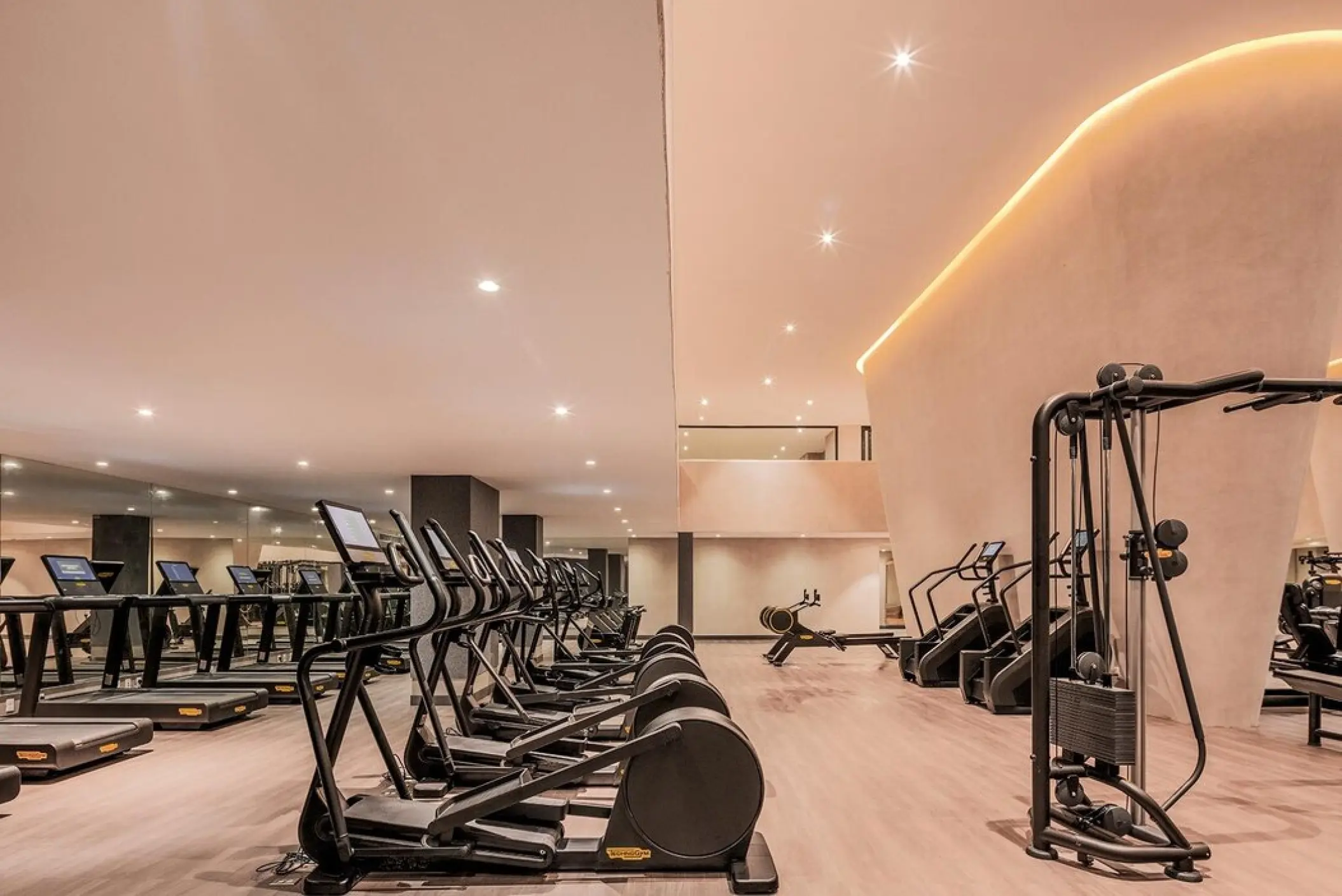 Modern gym with treadmills and ellipticals at AVA Resort Cancun