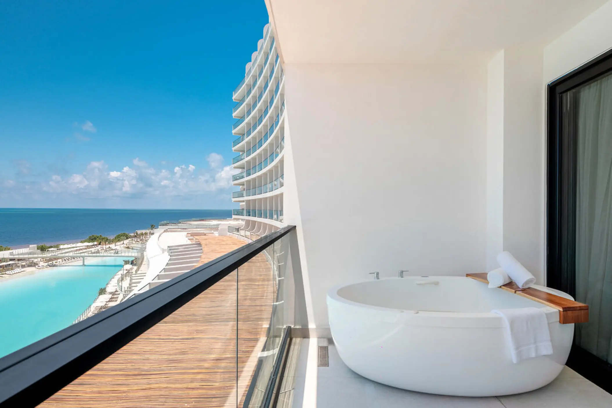 Private balcony soaking tub overlooking the Caribbean Sea at AVA Resort Cancun