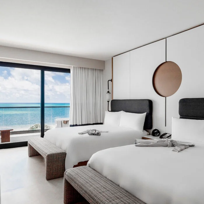 room with double beds at AVA Resort Cancun