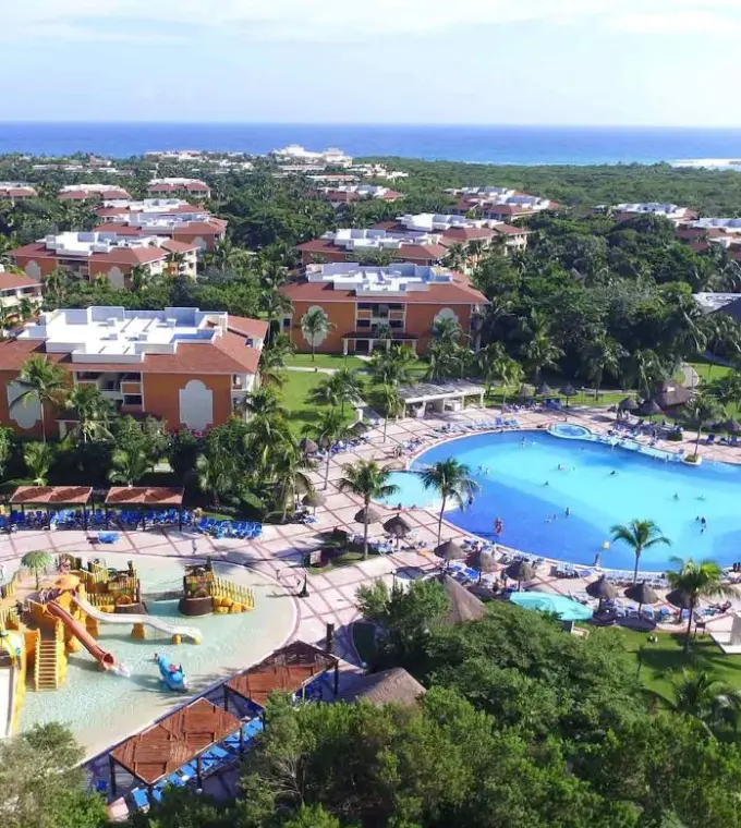 Aerial view of swimming pools and villas at Bahia Principe Grand Coba, Tulum