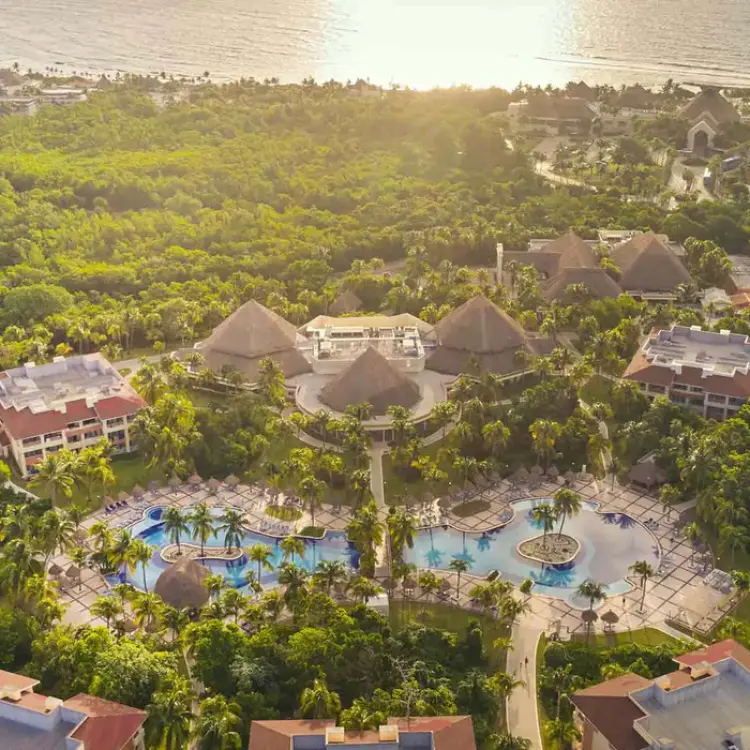 Aerial view of pools and lush tropical grounds at Bahia Principe Grand Coba, Tulum