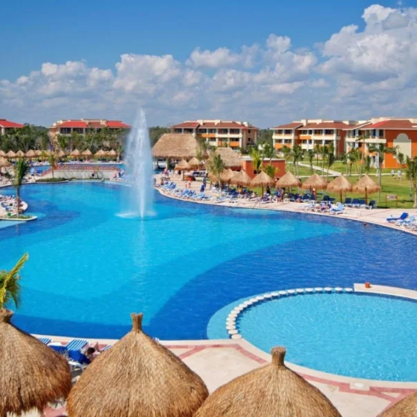 pool and buildings at Bahia Principe Grand Coba