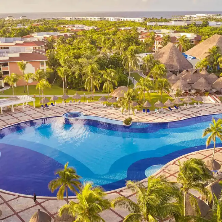 Bahia Principe Grand Coba large outdoor swimming pool surrounded by palm trees, Tulum