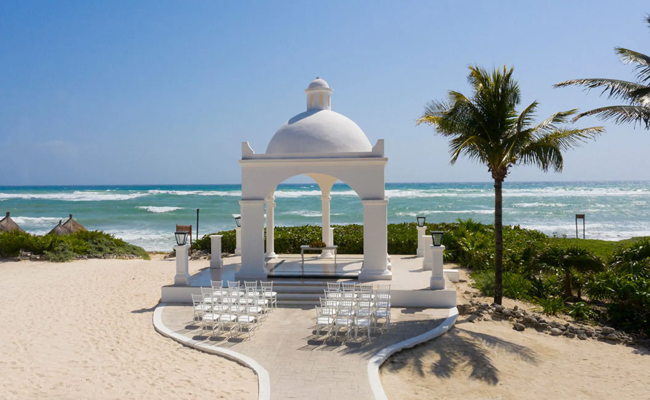 White beachfront gazebo wedding ceremony at Bahia Principe Luxury Akumal, Tulum
