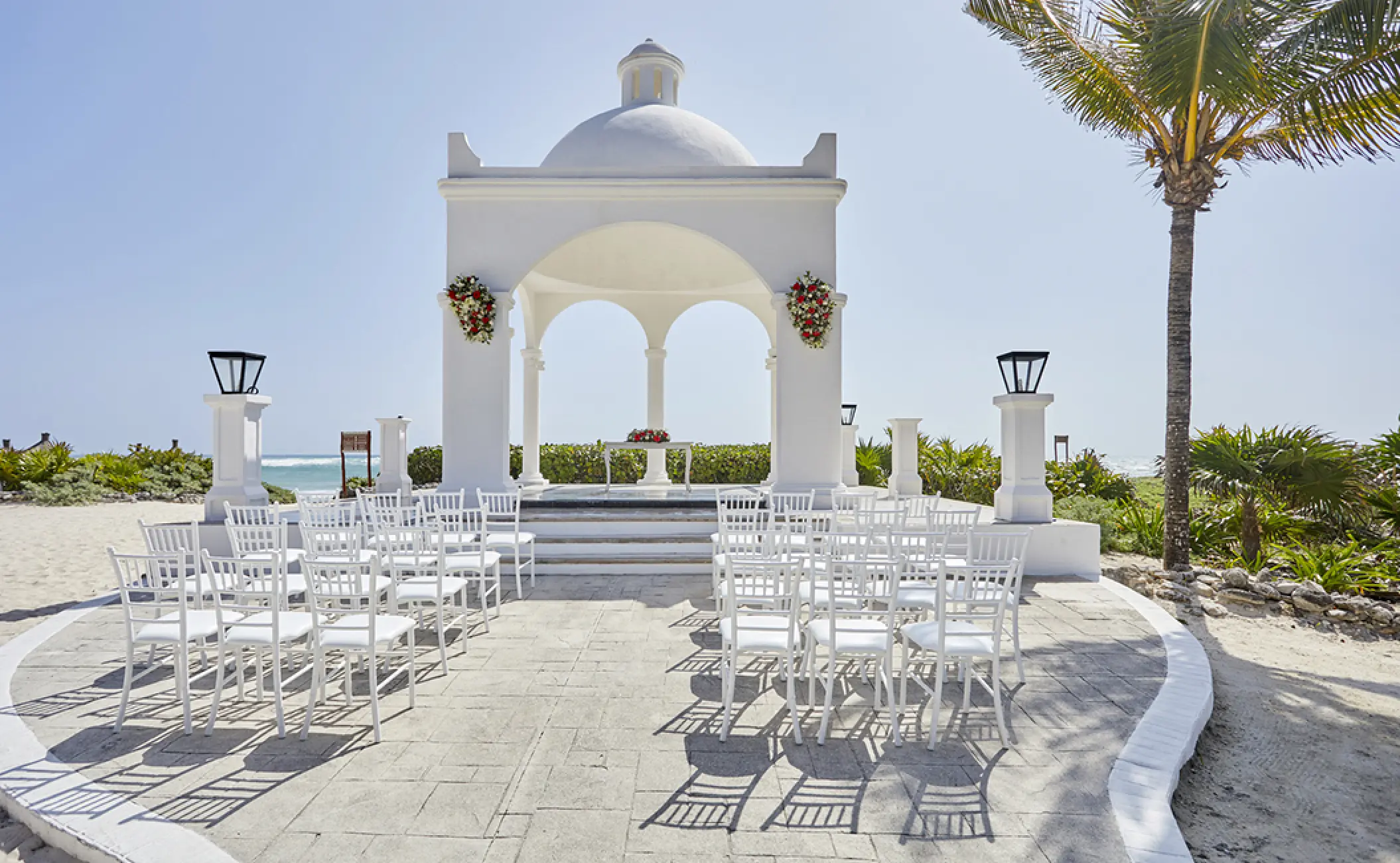 White beachfront gazebo wedding ceremony at Bahia Principe Akumal, Tulum