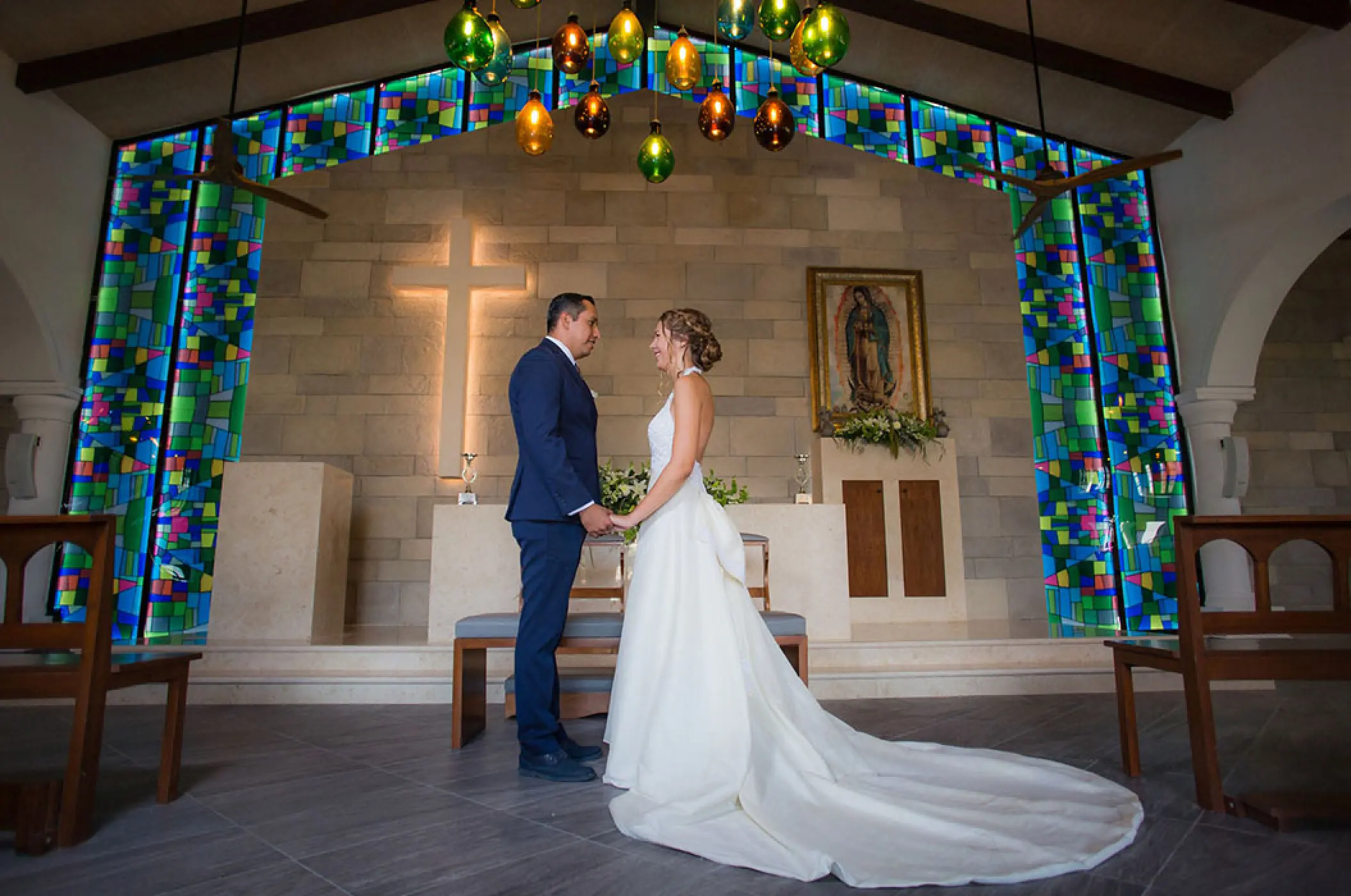 Bride and groom at the altar during a wedding ceremony at Bahia Principe Akumal, Tulum
