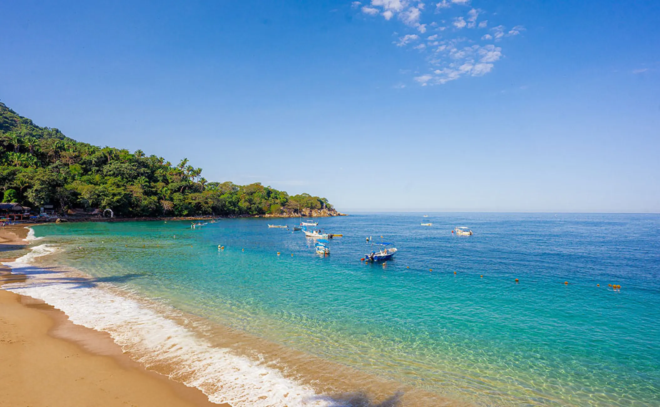 Turquoise water and beach with boats near Barcelo Puerto Vallarta, Puerto Vallarta