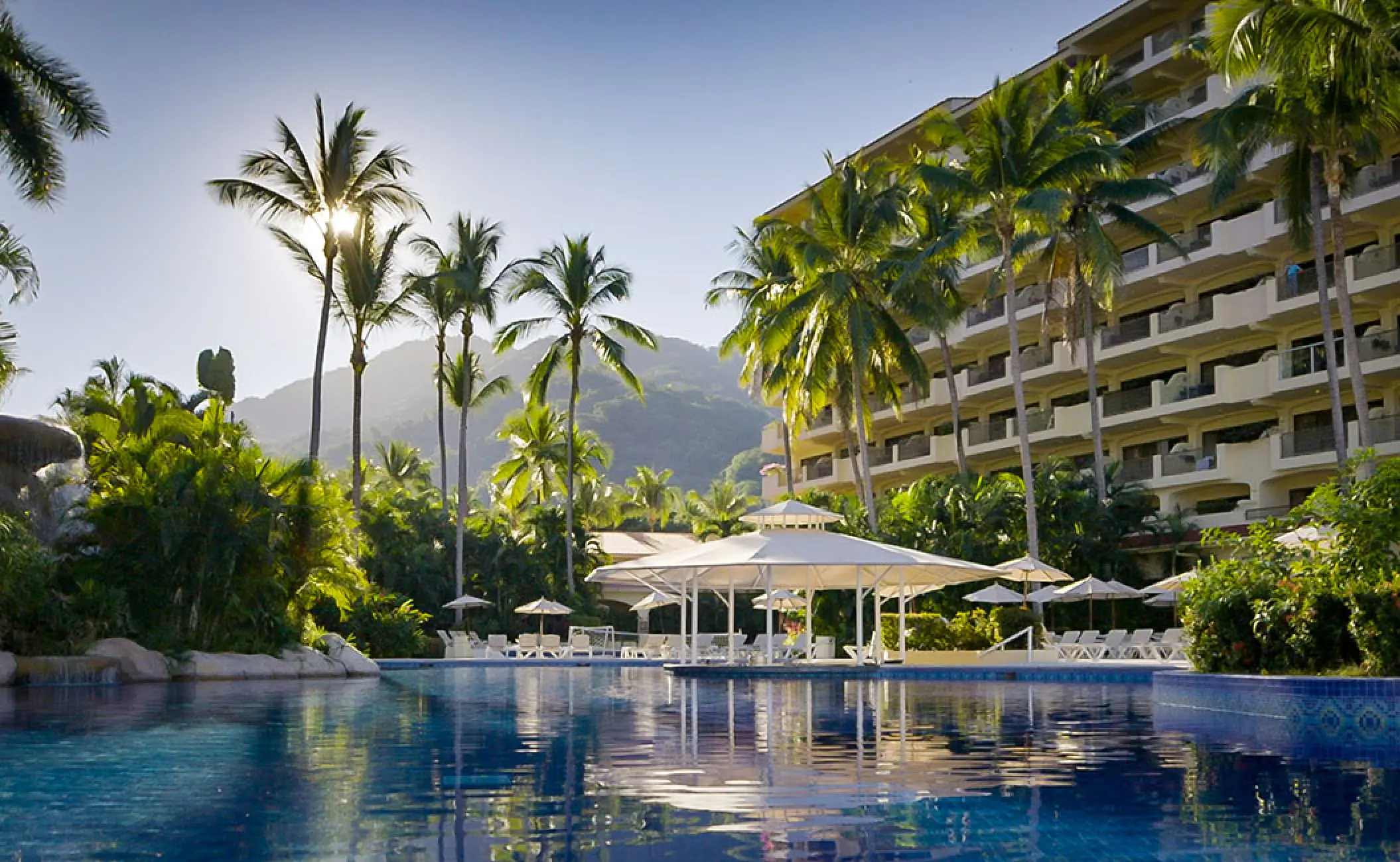 Barcelo Puerto Vallarta swimming pools and guest buildings surrounded by palm trees, Puerto Vallarta