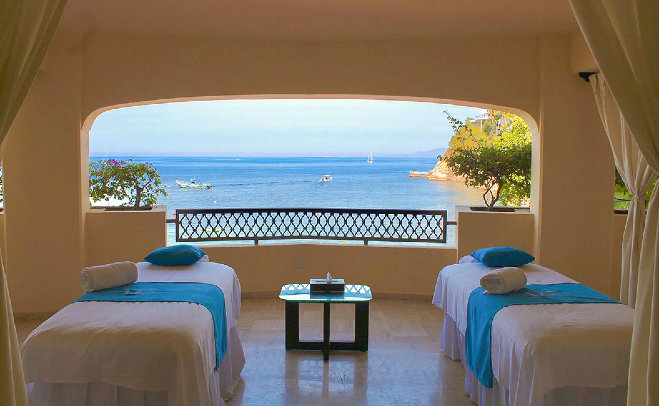 Spa massage tables in an open-air cabin overlooking the ocean at Barcelo Puerto Vallarta