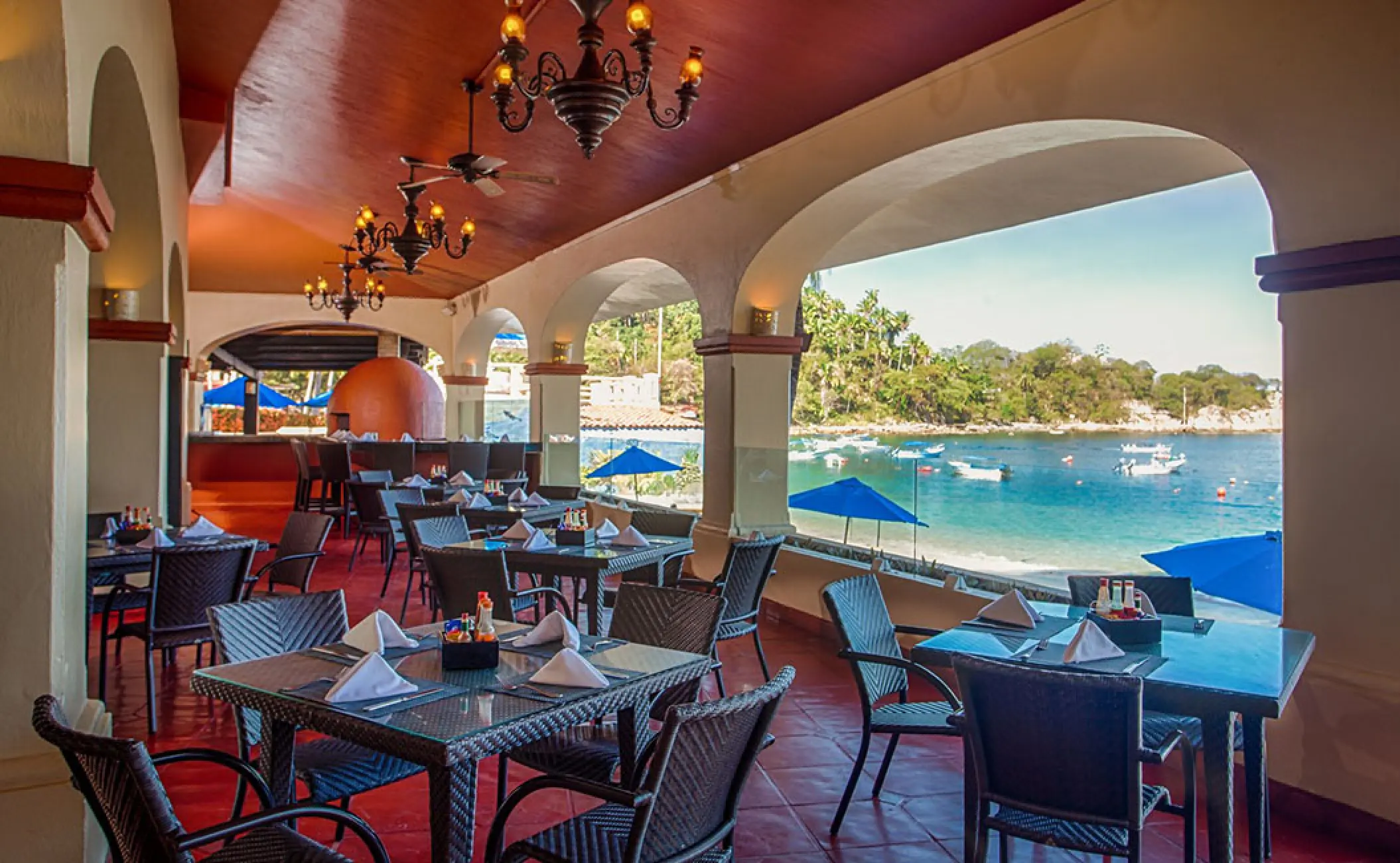 Outdoor Italian restaurant overlooking the ocean at Barcelo Puerto Vallarta