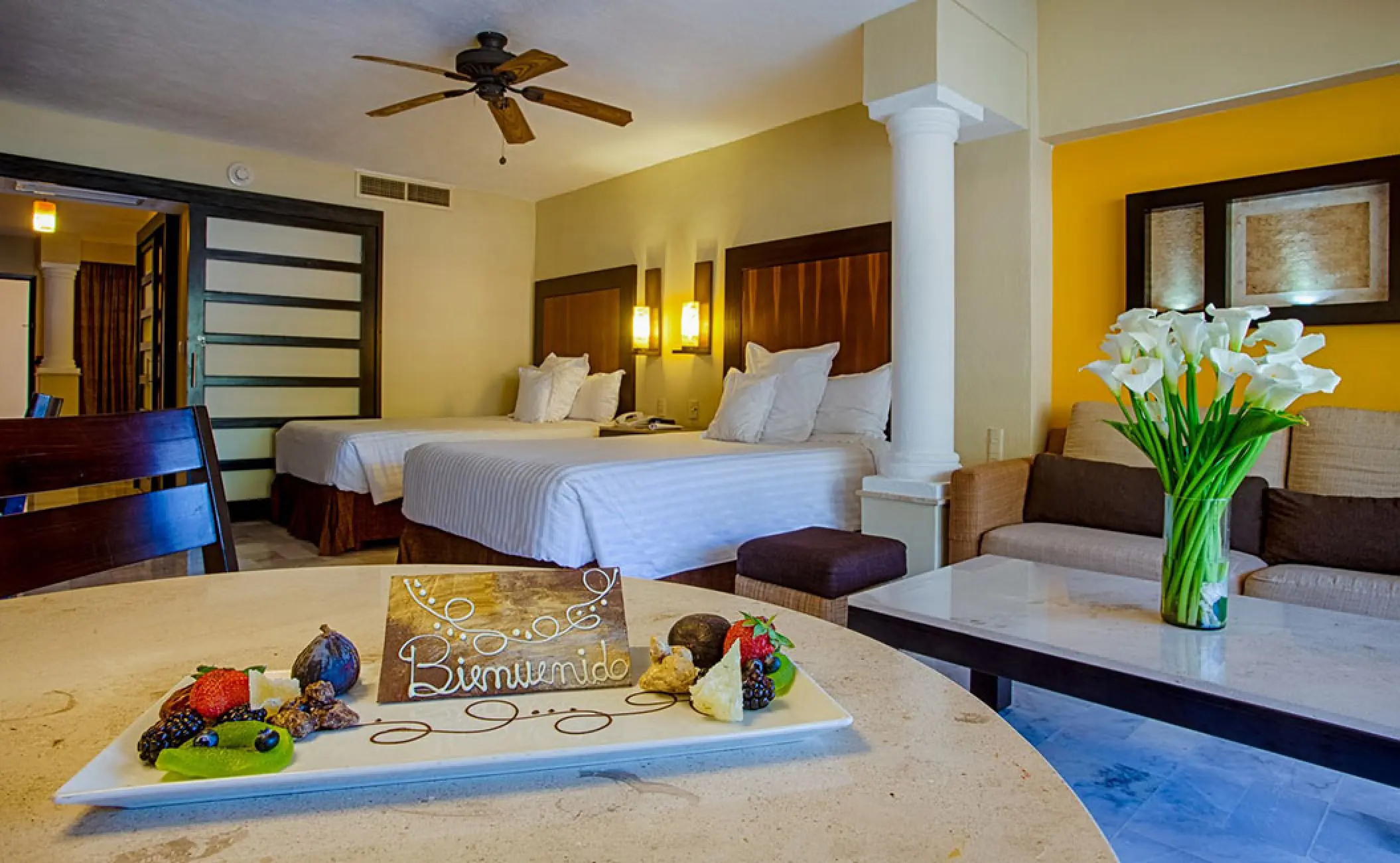 Deluxe Double suite with fruit platter and welcome sign at Barcelo Puerto Vallarta