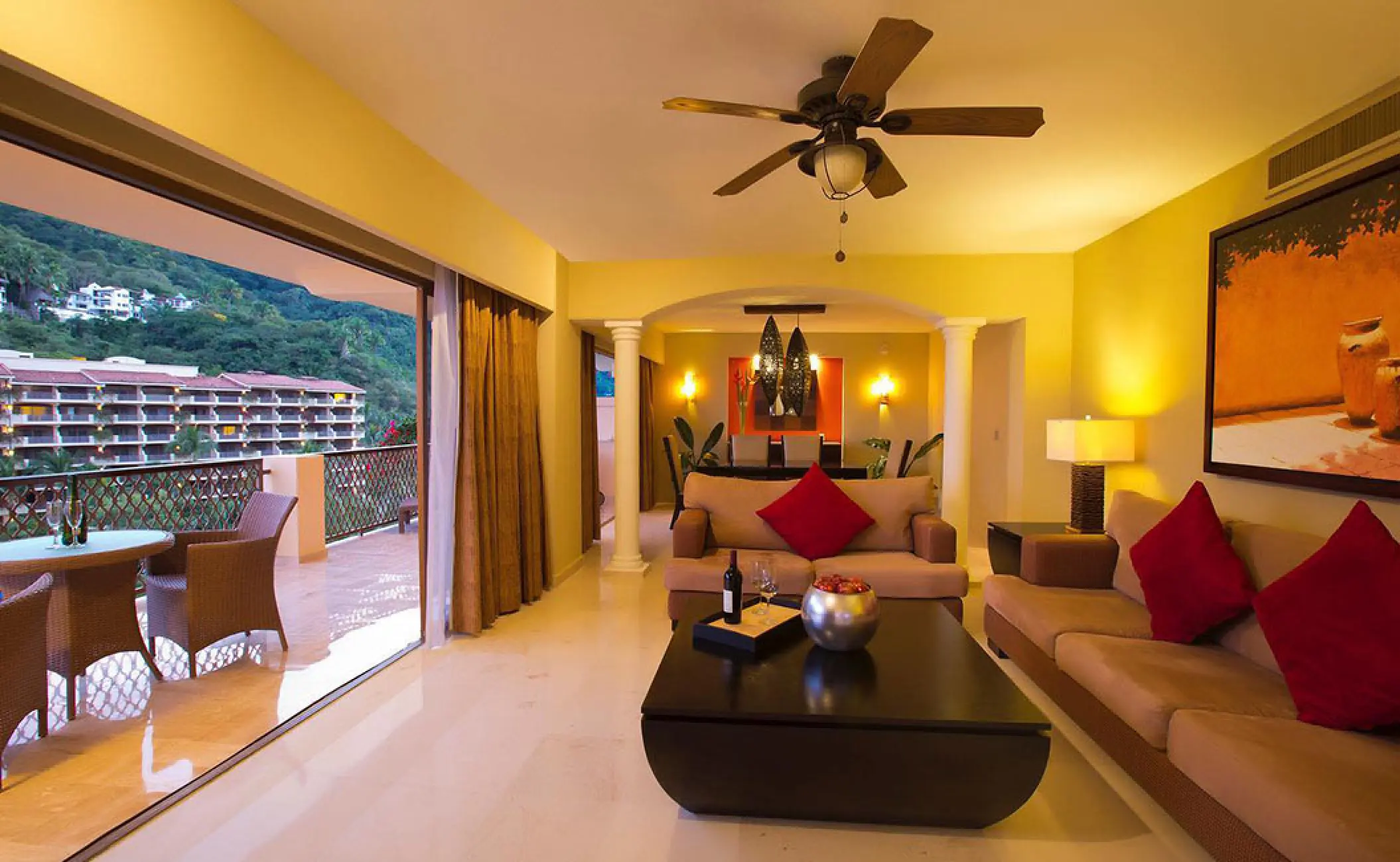 Suite living area and private balcony at Barcelo Puerto Vallarta