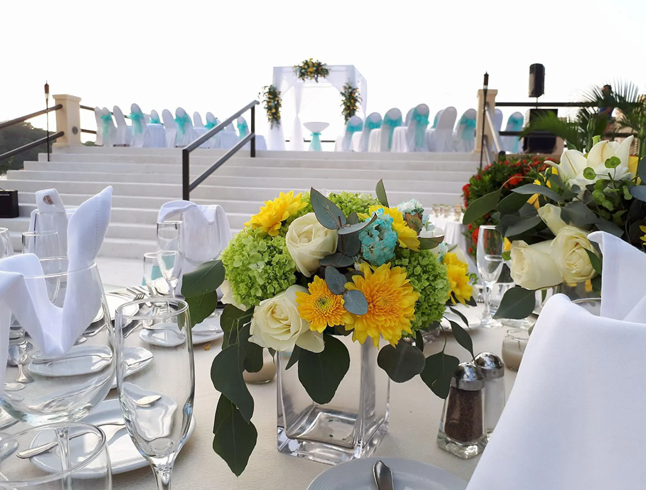 Terrace wedding ceremony and reception setup at Barcelo Puerto Vallarta