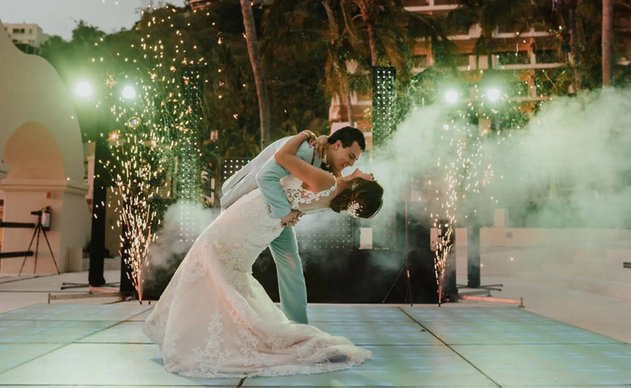 Bride and groom sharing a first dance with sparklers and smoke at Barcelo Puerto Vallarta, Puerto Vallarta