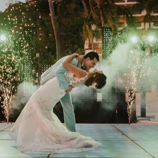 Bride and groom sharing a first dance with sparklers and smoke at Barcelo Puerto Vallarta, Puerto Vallarta