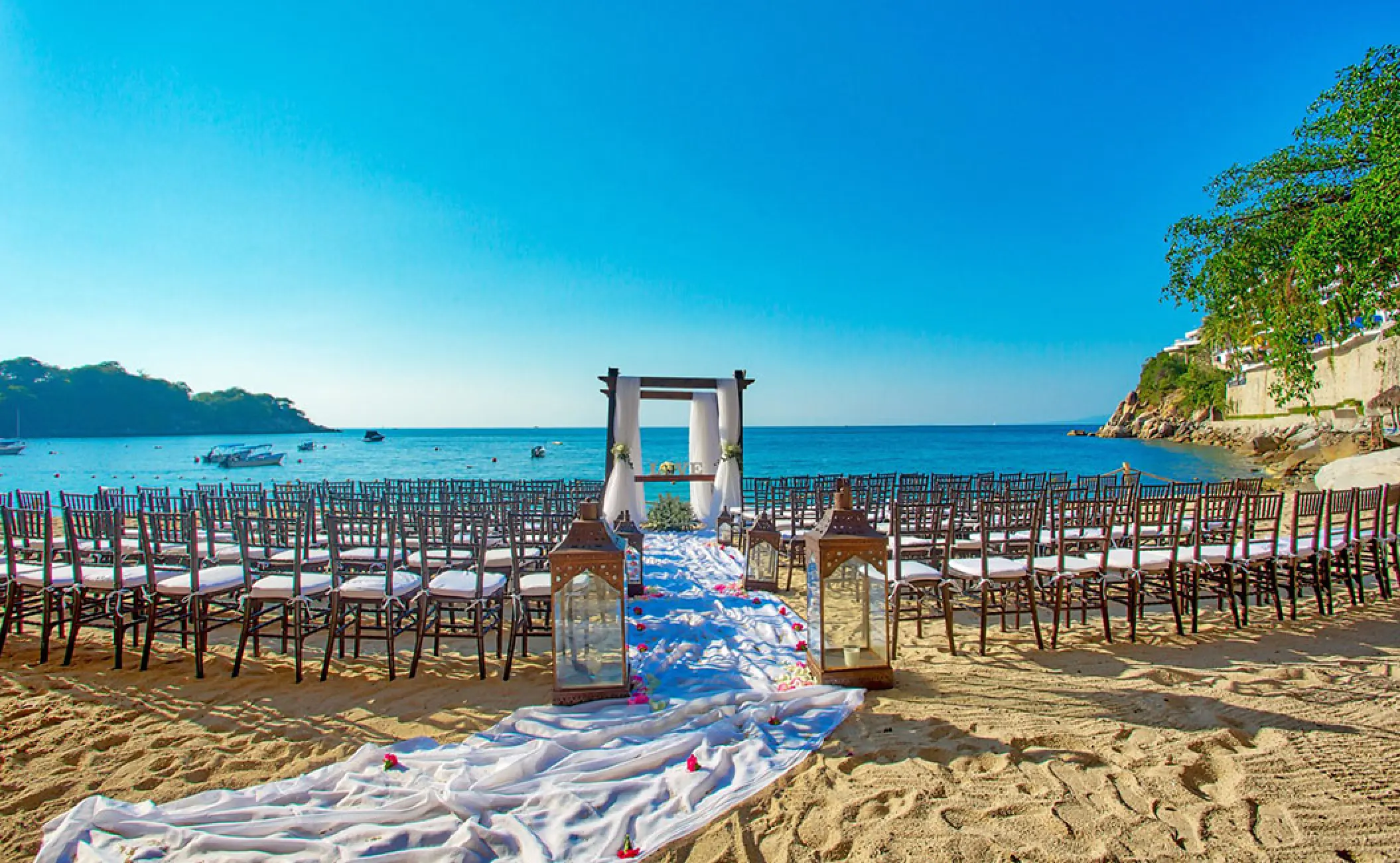 Beach wedding ceremony setup at Barcelo Puerto Vallarta, Puerto Vallarta