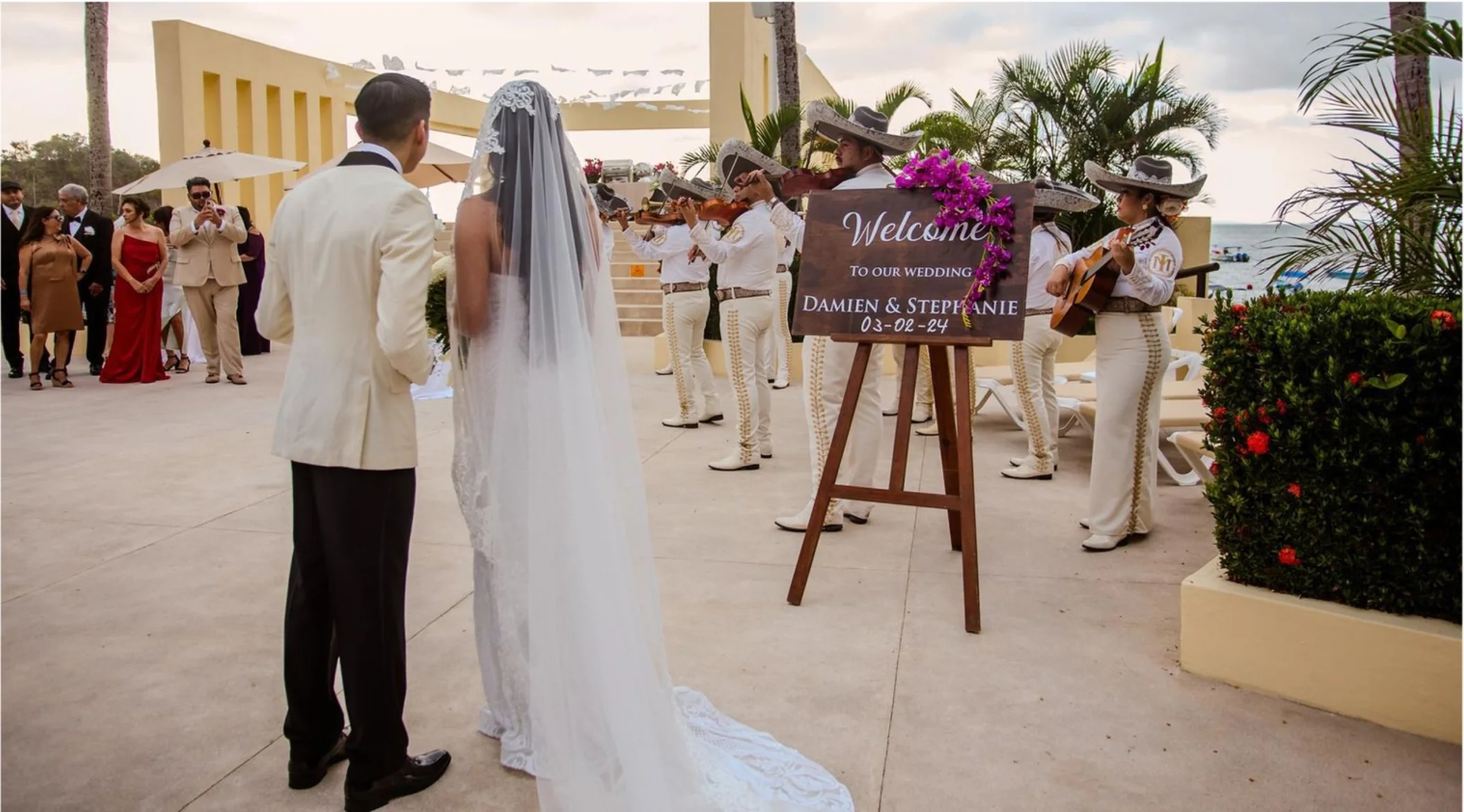 bride and groom with a mariachi band at barcelo puerto vallarta's deck venue