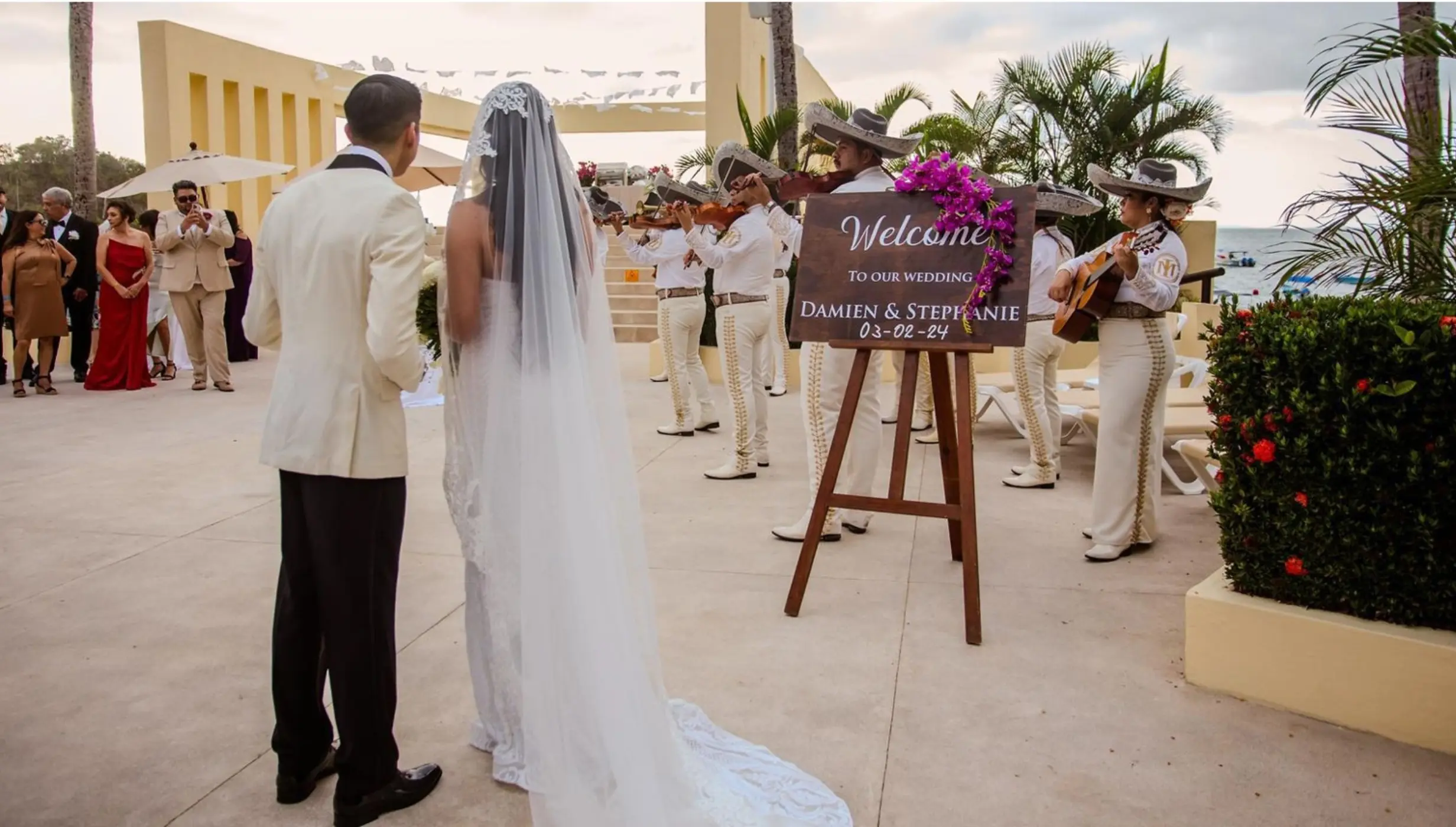 bride and groom with a mariachi band at barcelo puerto vallarta's deck venue
