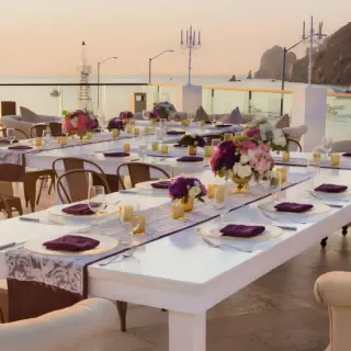 Rooftop wedding reception at Breathless Cabo San Lucas overlooking the ocean at sunset
