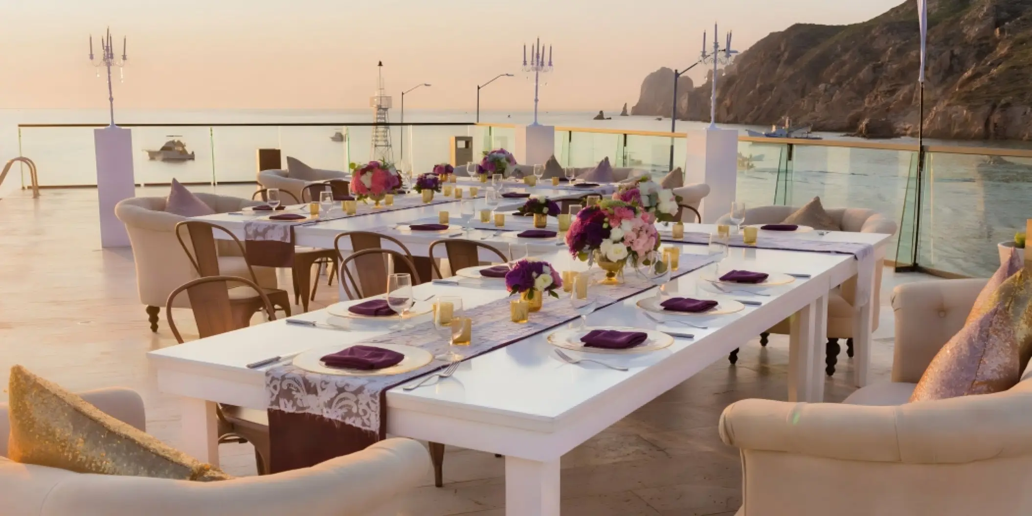 Rooftop wedding reception at Breathless Cabo San Lucas overlooking the ocean at sunset