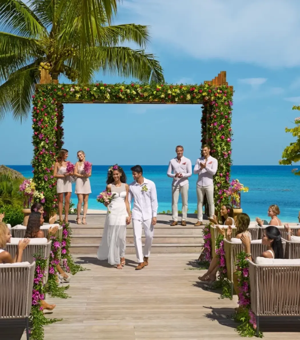 The couple walking down the aisle at a Breathless Montego Bay wedding ceremony, Jamaica