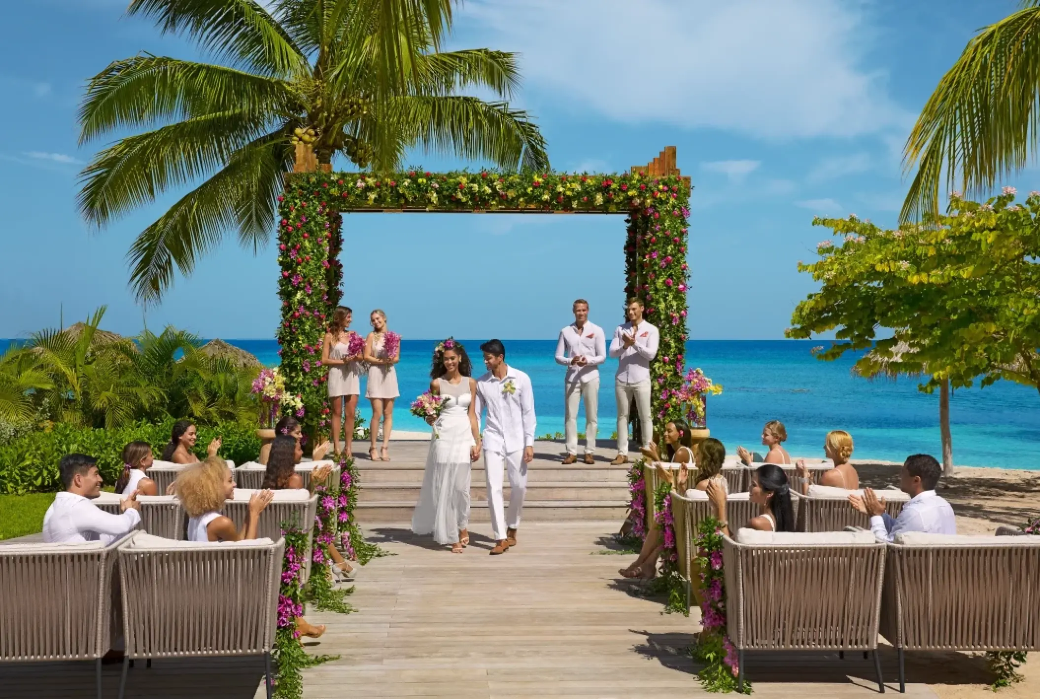 The couple walking down the aisle at a Breathless Montego Bay wedding ceremony, Jamaica