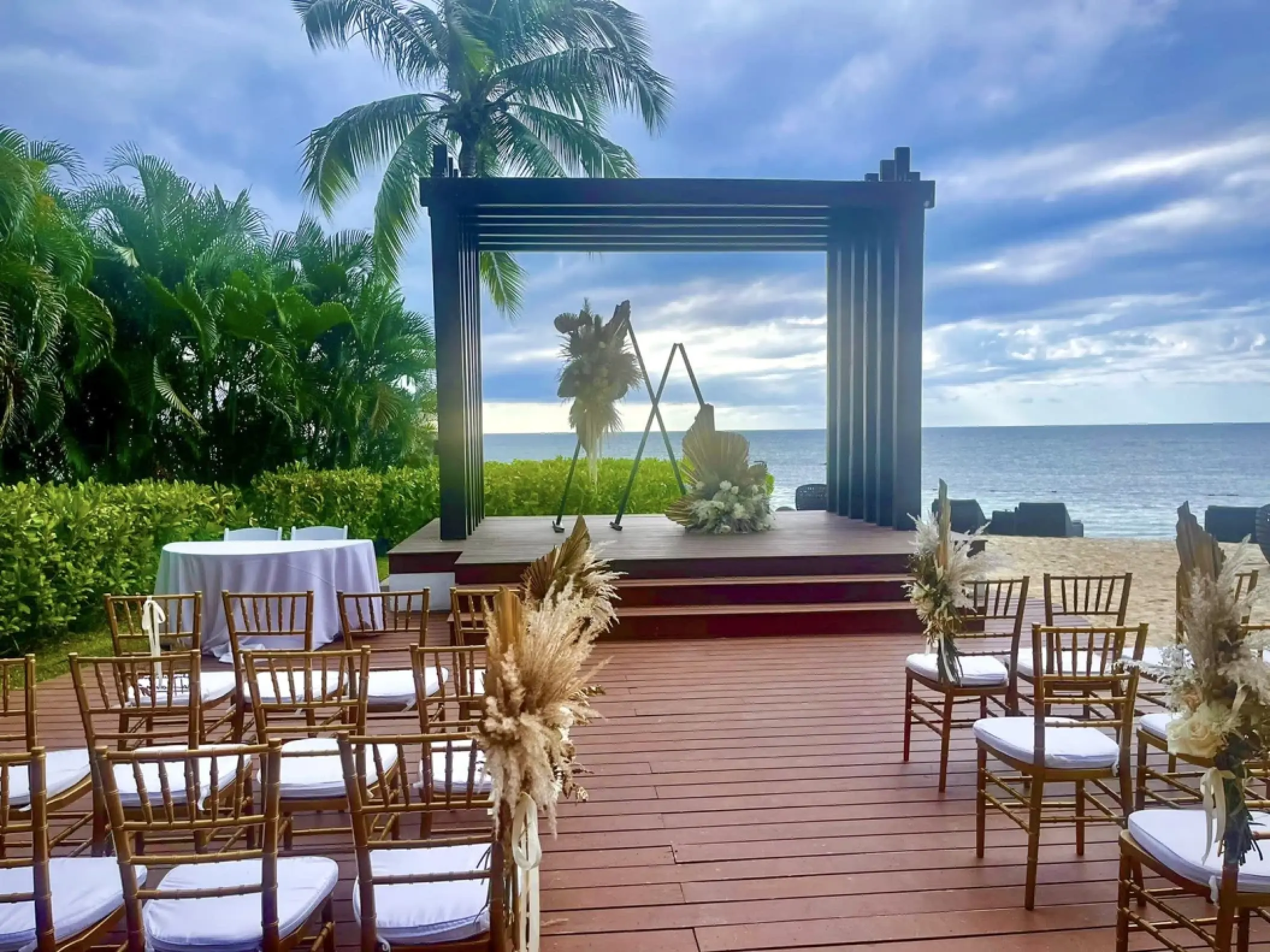 Beachfront wedding ceremony with a dark wood gazebo at Breathless Montego Bay, Montego Bay