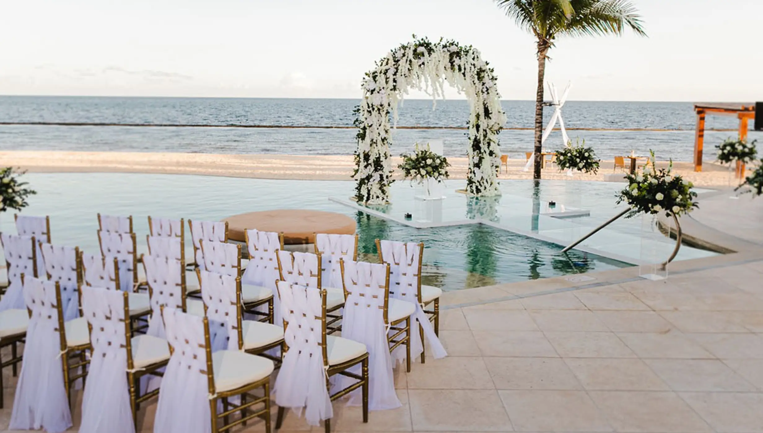 Over the water wedding venue at Breathless Riviera Cancun resort.