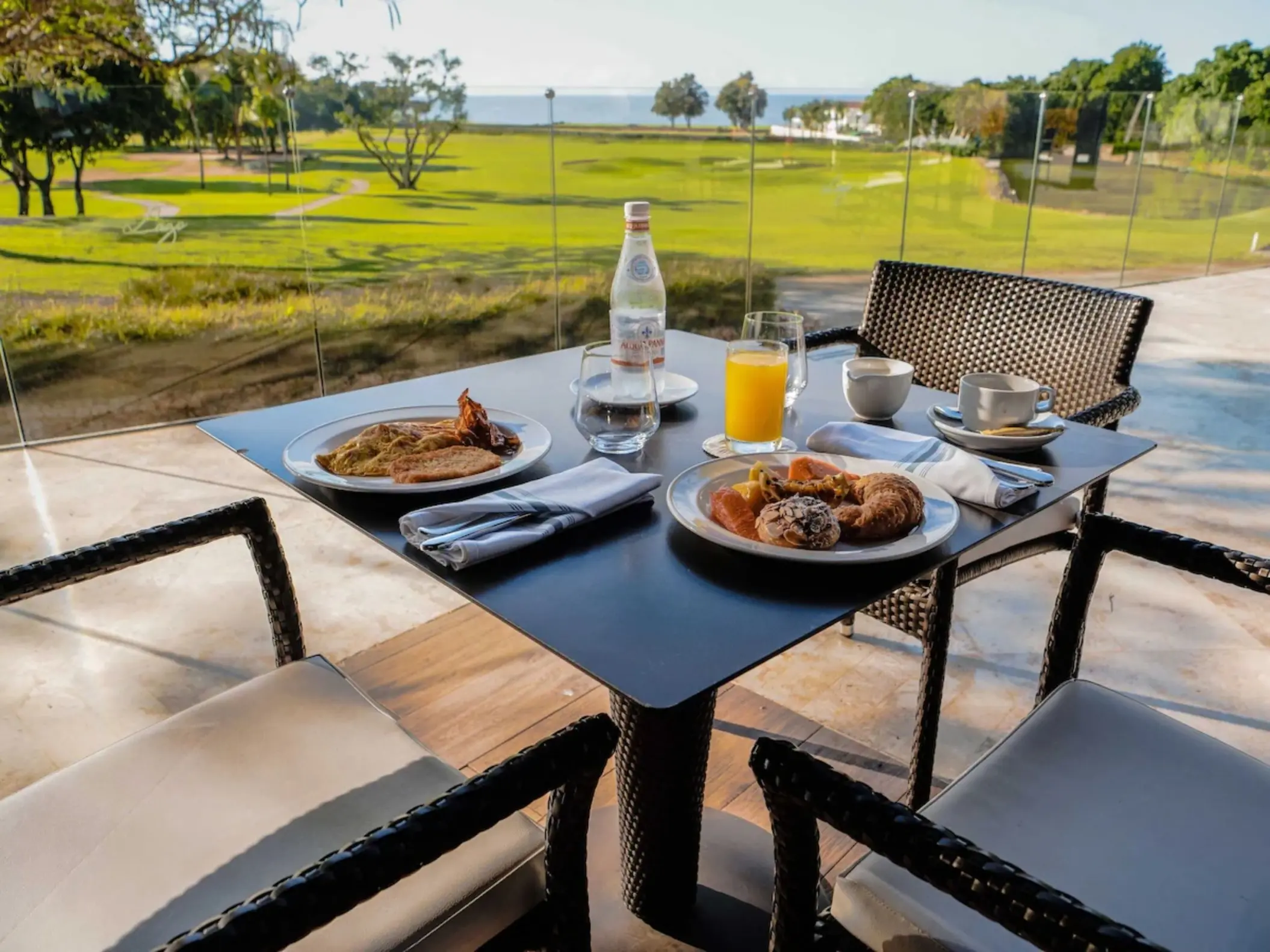 Outdoor breakfast spread on a patio at Casa de Campo, La Romana
