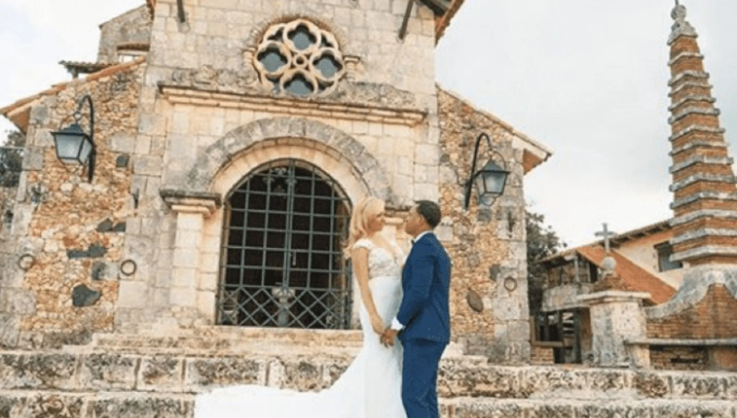 bride and groom outside church at Casa de Campo