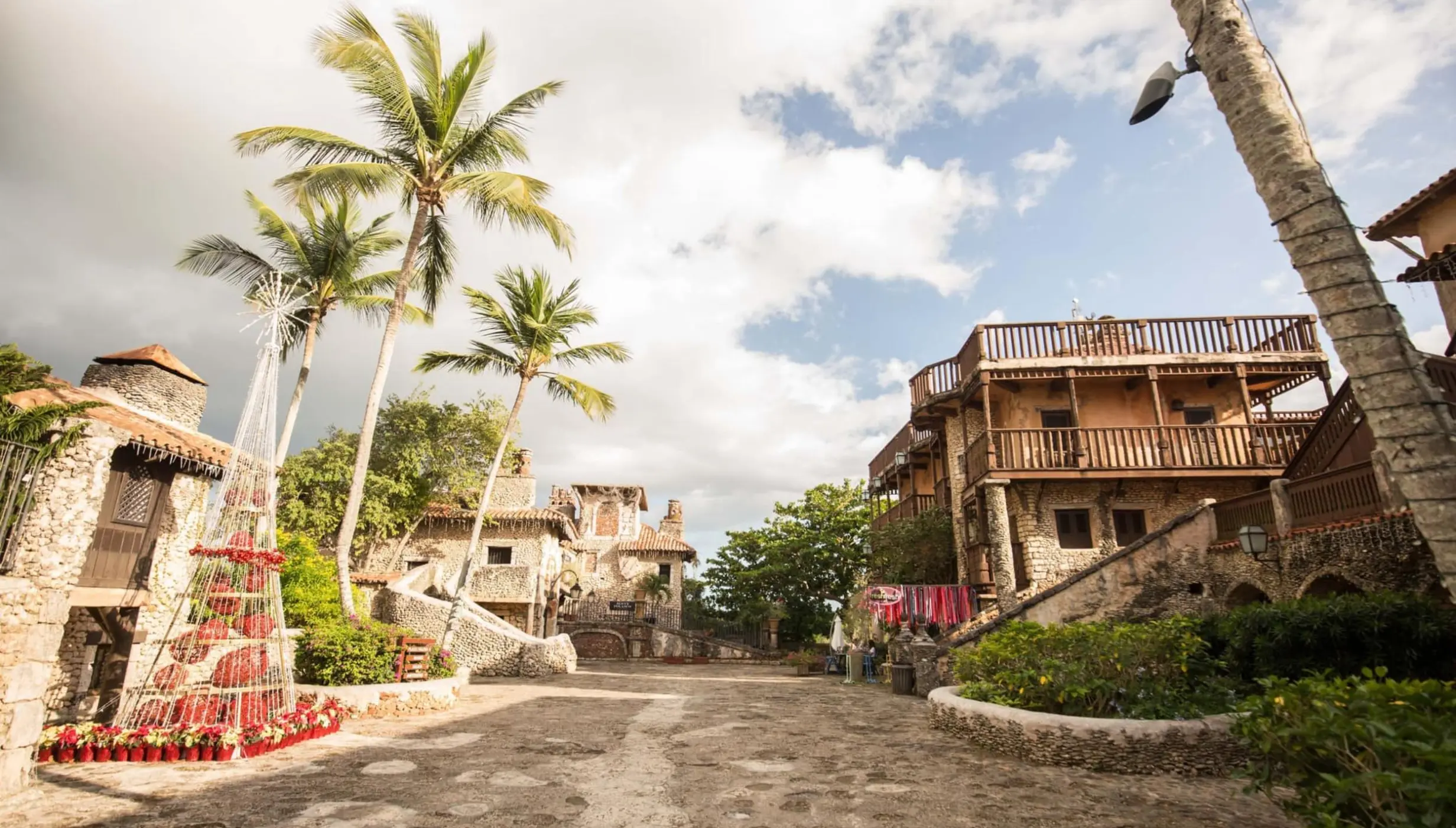 Stone buildings and palm trees at Chavon Plaza wedding venue in Casa de Campo, La Romana