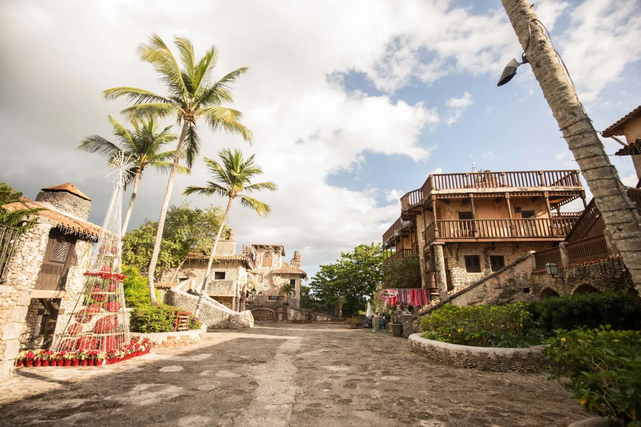 Stone buildings and palm trees at Chavon Plaza wedding venue in Casa de Campo, La Romana