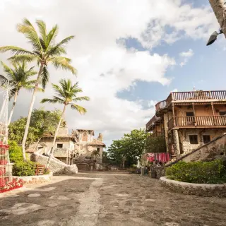 Stone buildings and palm trees at Chavon Plaza wedding venue in Casa de Campo, La Romana