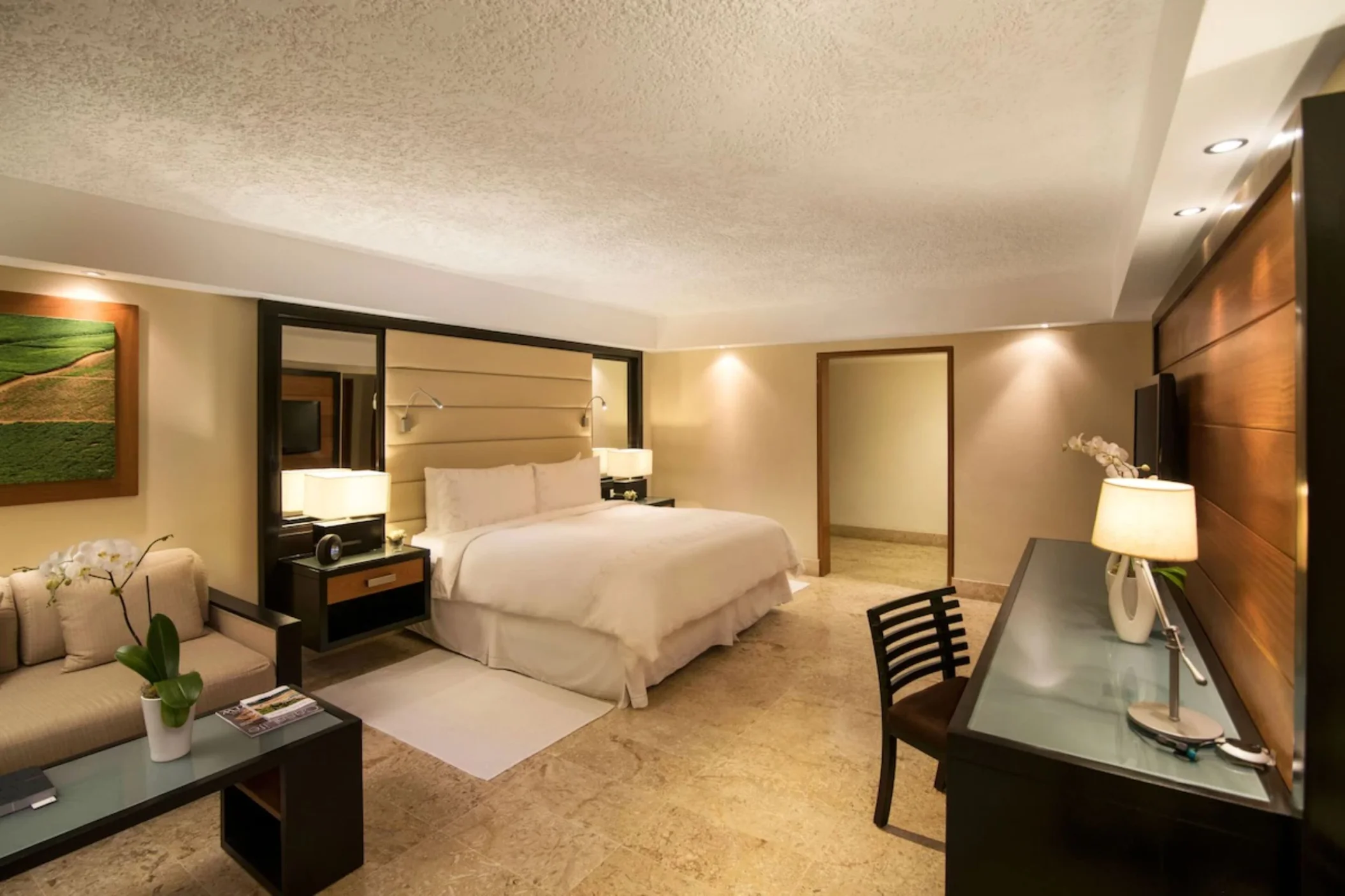 elite room with king bed and amenities at Casa de Campo