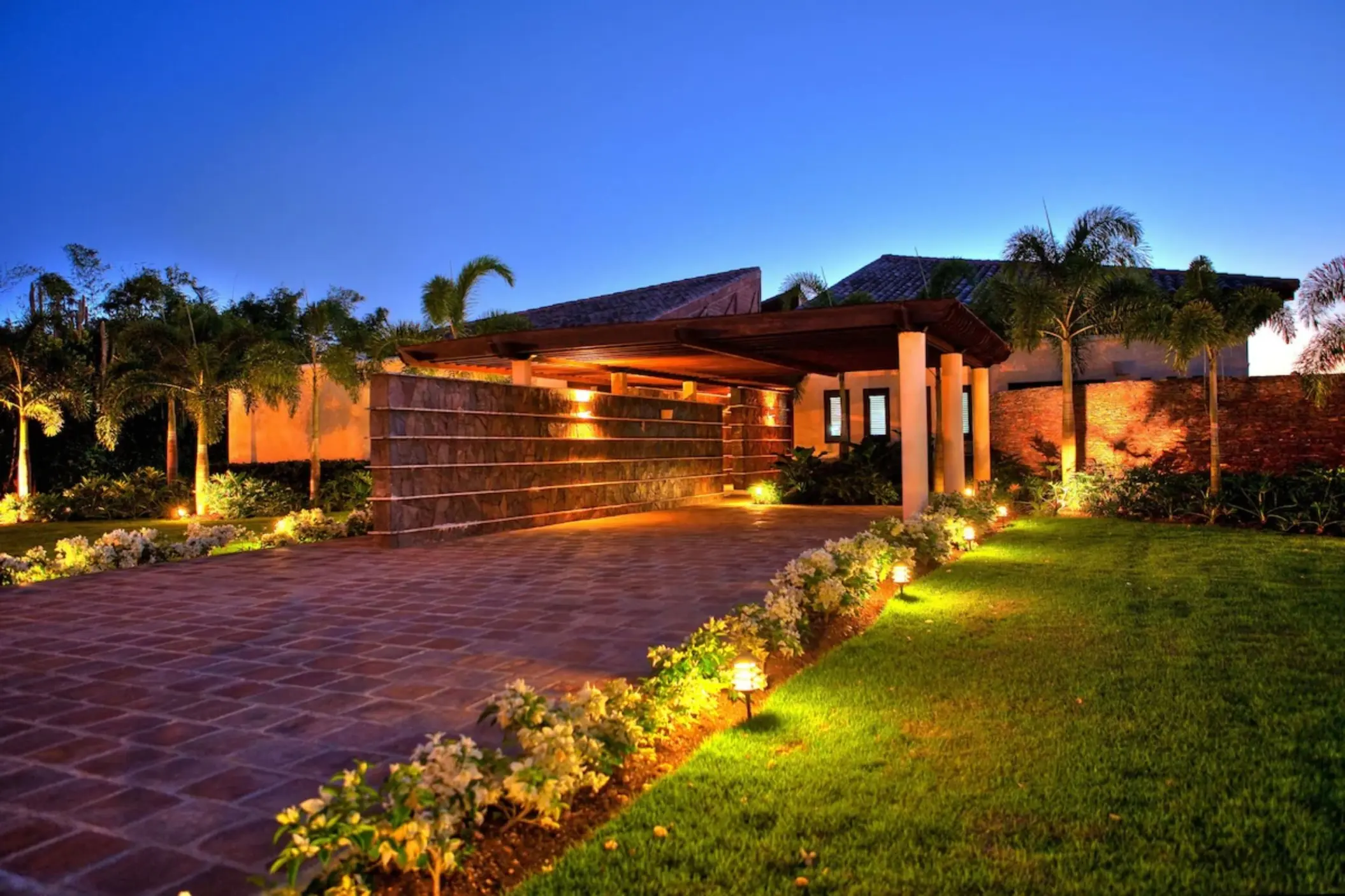 Classic four-bedroom villa exterior at night at Casa de Campo, La Romana