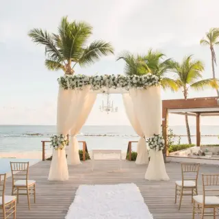 Beachfront wedding ceremony on a wooden deck at Casa de Campo, La Romana