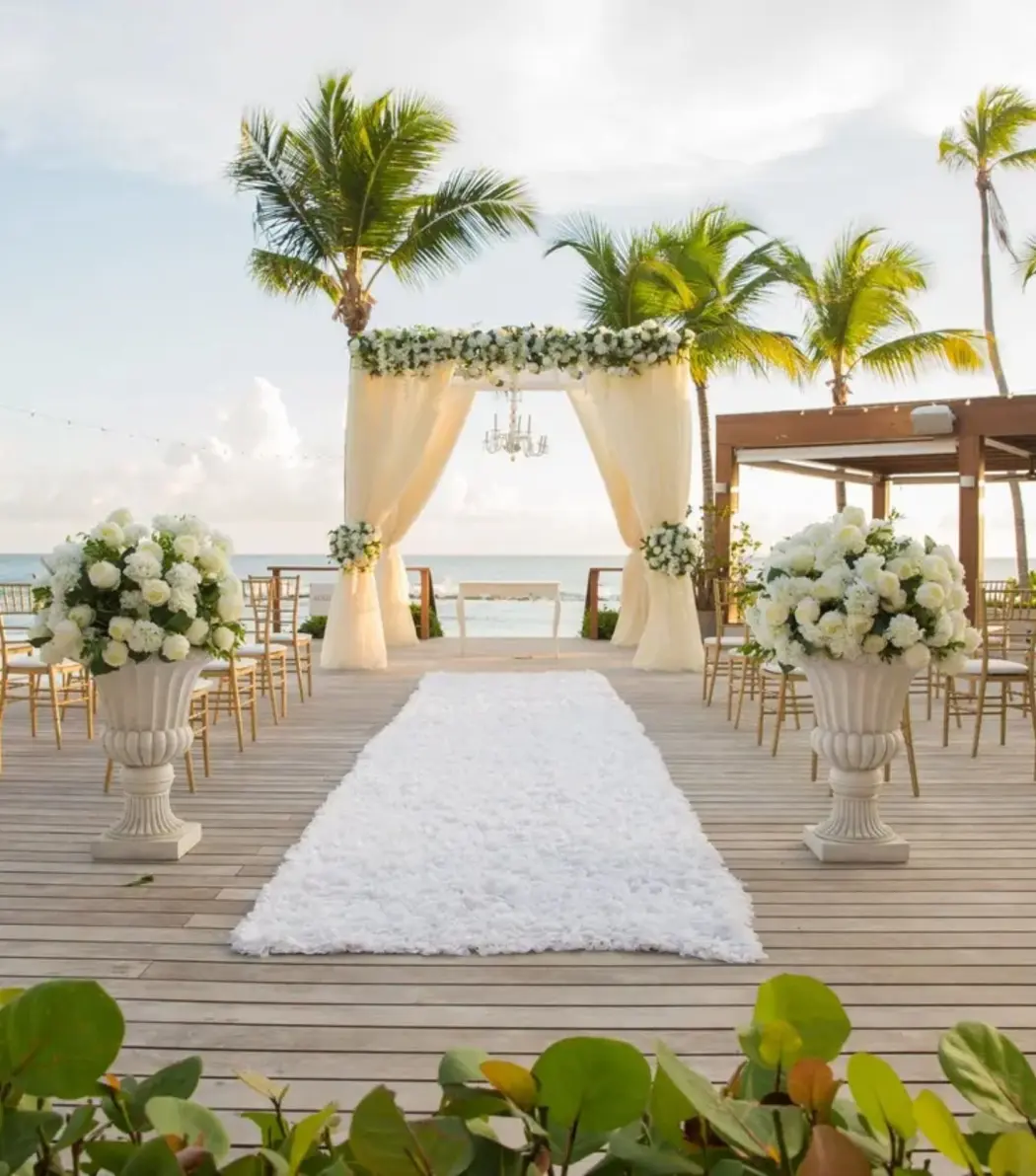Beachfront wedding ceremony on a wooden deck at Casa de Campo, La Romana