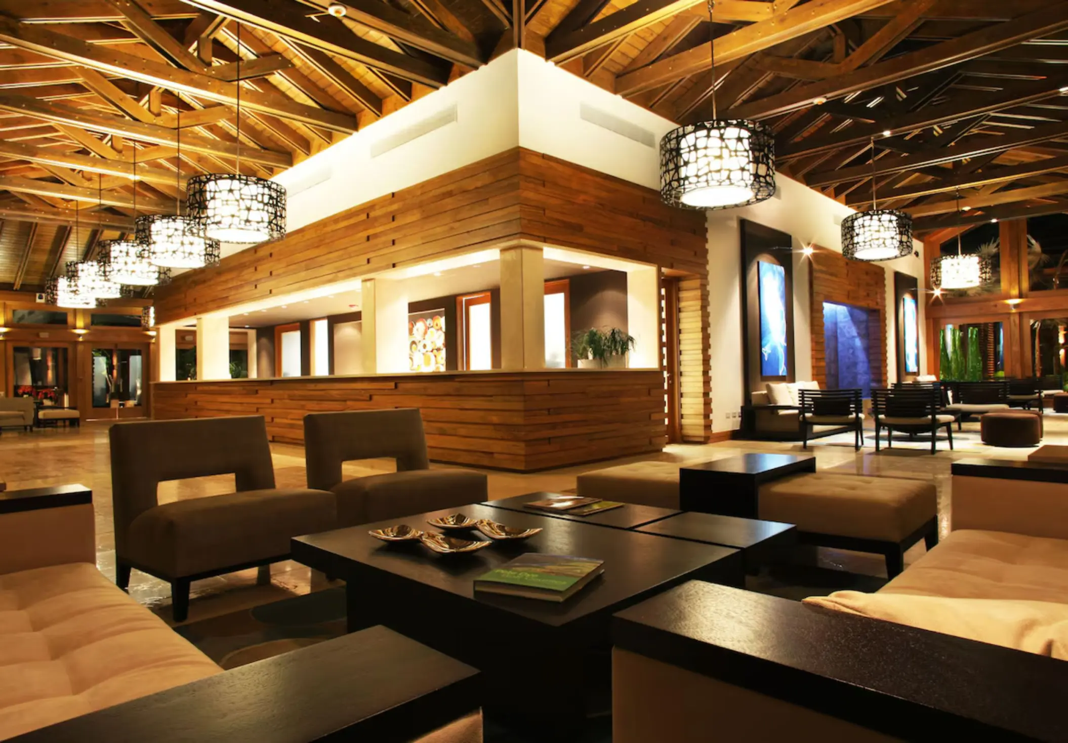 Lobby lounge with wood-paneled accents and vaulted ceiling at Casa de Campo, La Romana