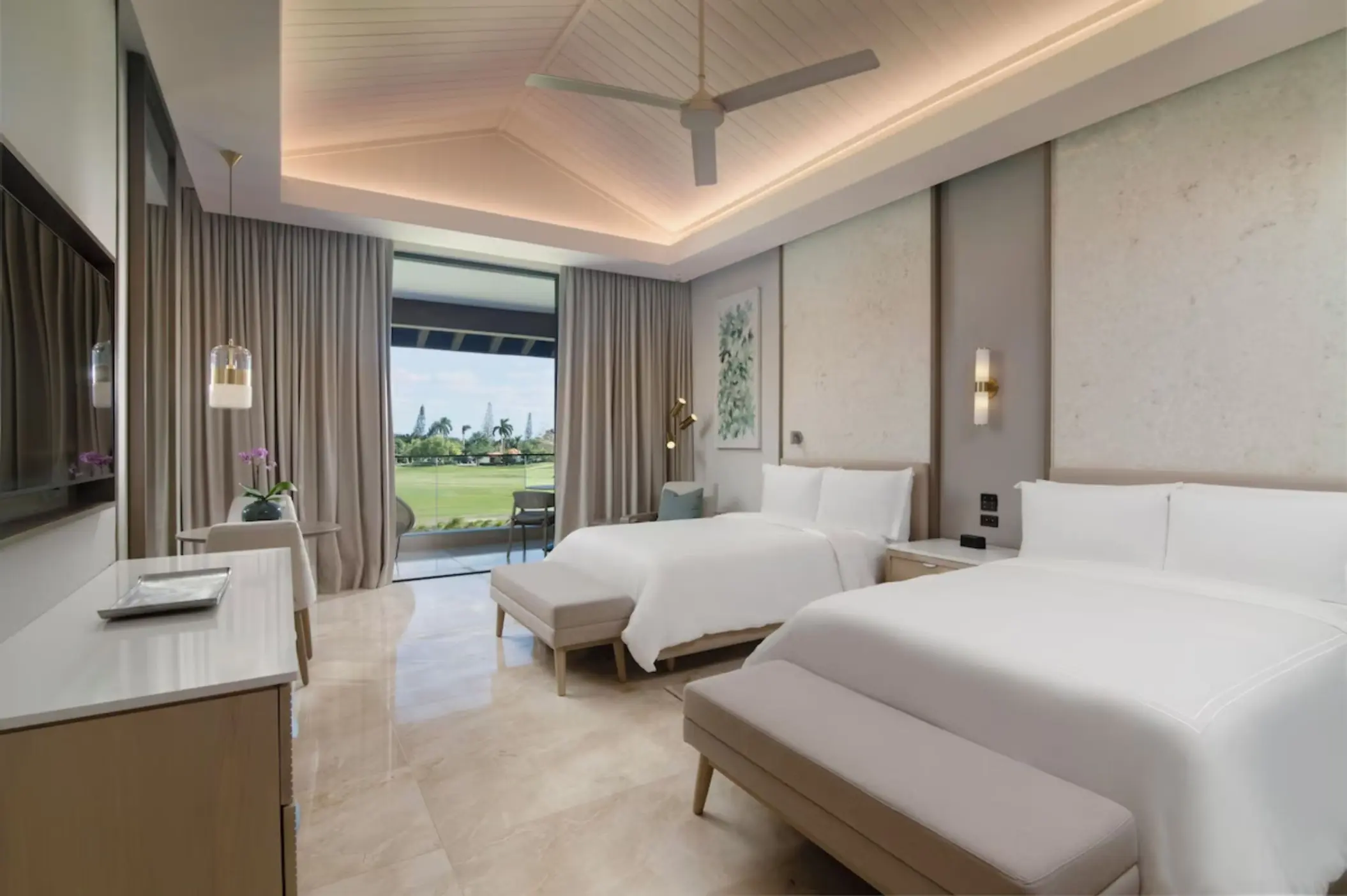 Modern suite with two beds and a private balcony at Casa de Campo, La Romana