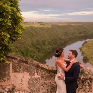 Bride and groom portrait overlooking the river at Casa de Campo, La Romana
