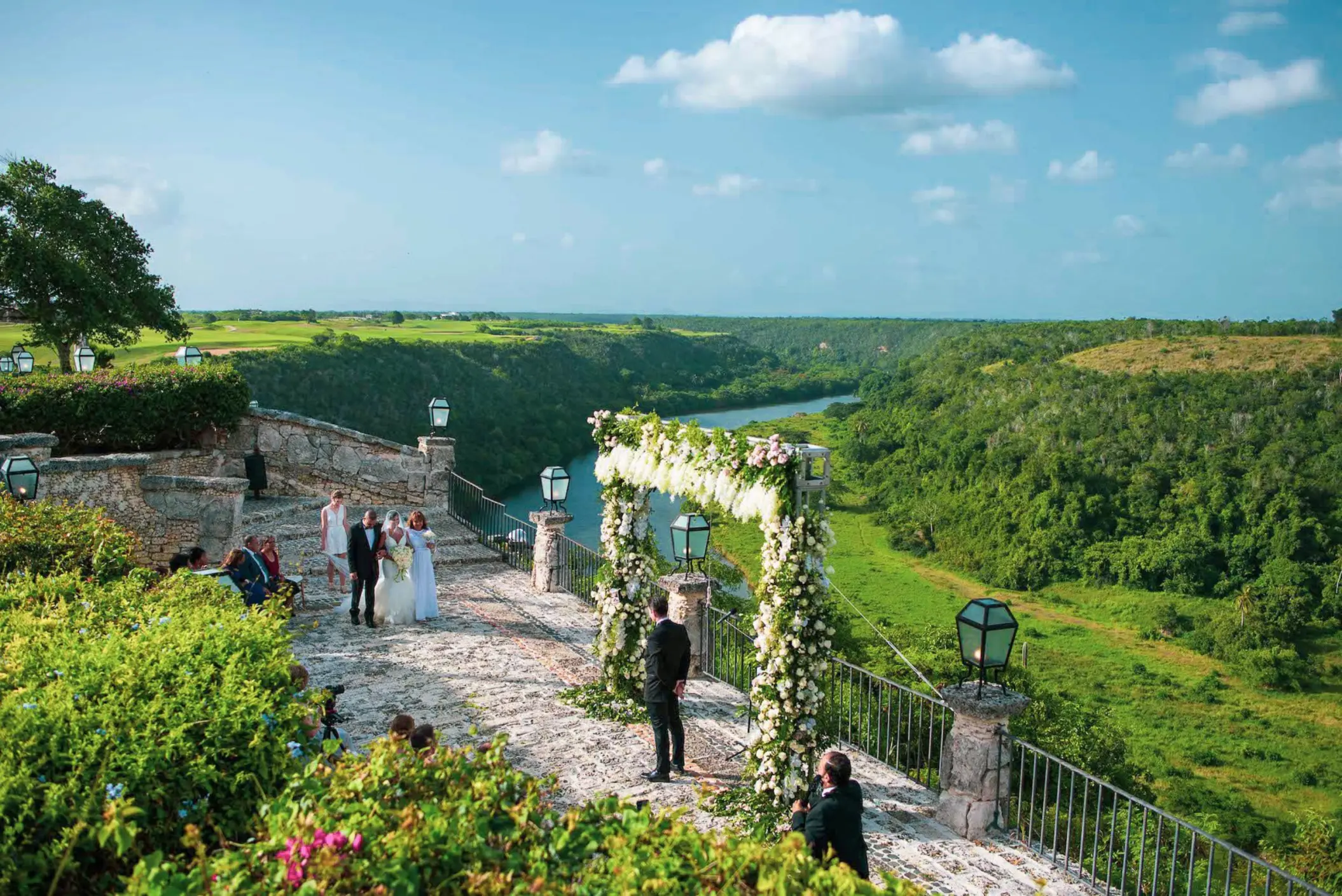 Stone terrace wedding ceremony at Casa de Campo overlooking the Chavón River, La Romana