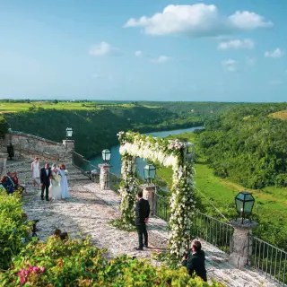 Stone terrace wedding ceremony at Casa de Campo overlooking the Chavón River, La Romana