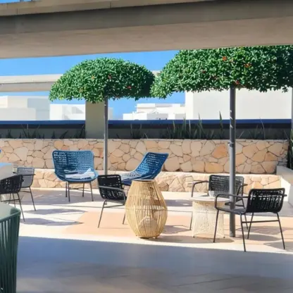 Outdoor terrace wedding reception area with blue and black seating at Catalonia Grand Costa Mujeres, Cancun