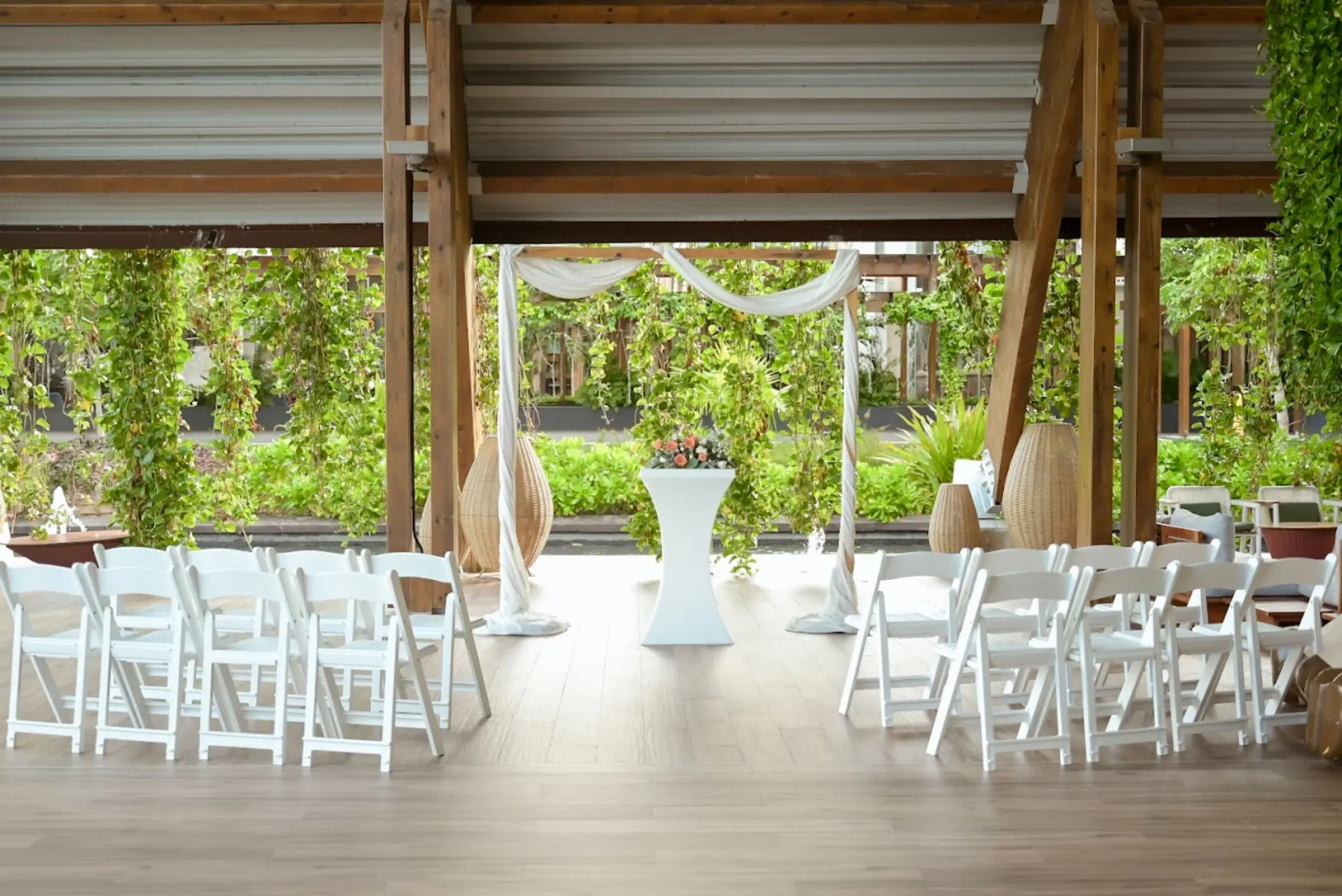 Dome wedding ceremony with white chairs and floral arch at Catalonia Grand Costa Mujeres, Cancun