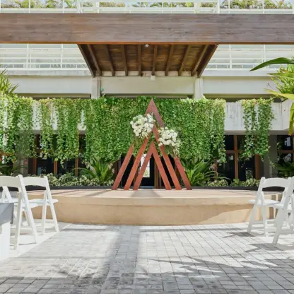 Triangle arch wedding ceremony setup at Catalonia Grand Costa Mujeres, Cancun