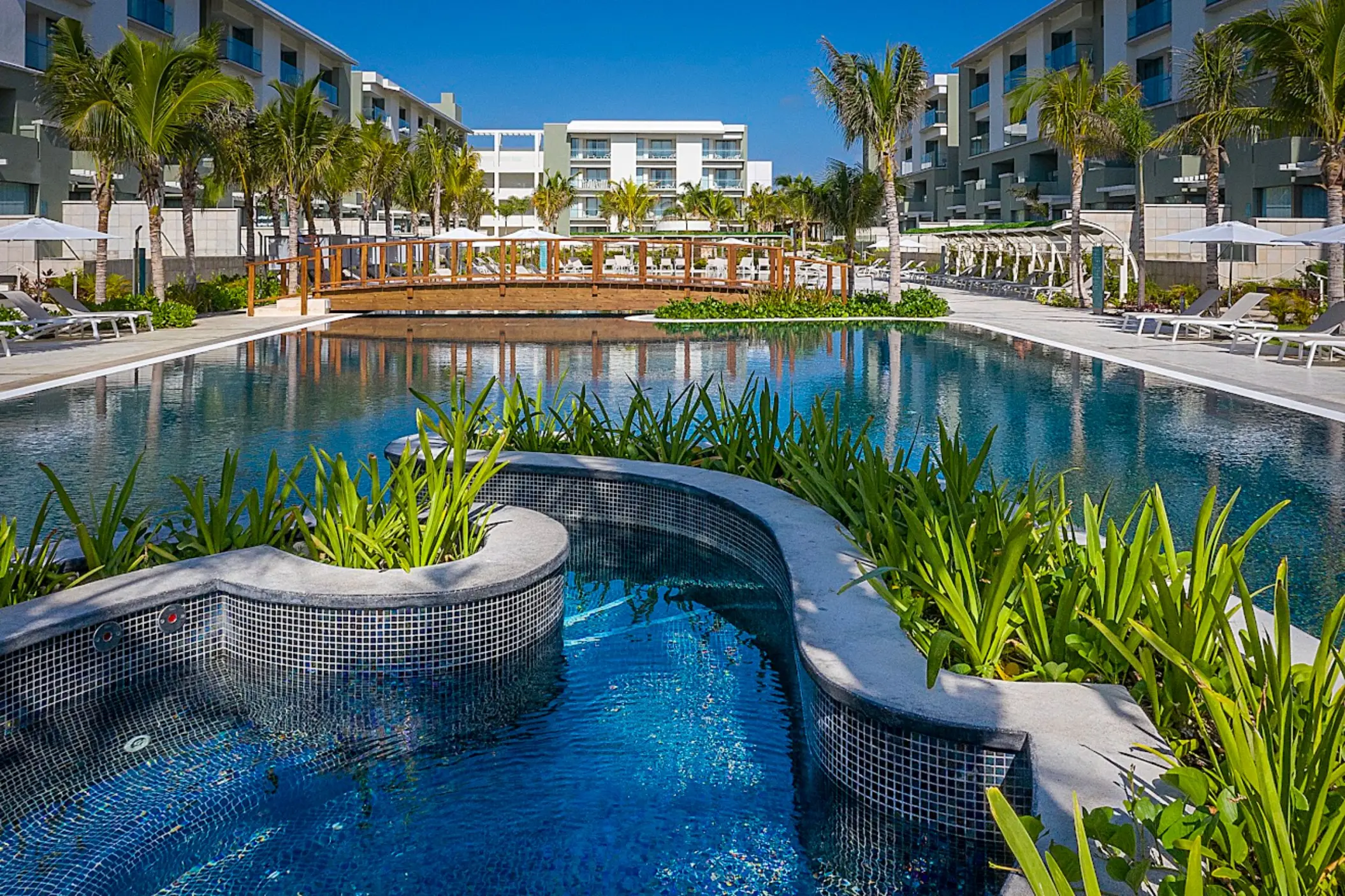 Catalonia Grand Costa Mujeres swimming pool and wooden bridge, Cancun