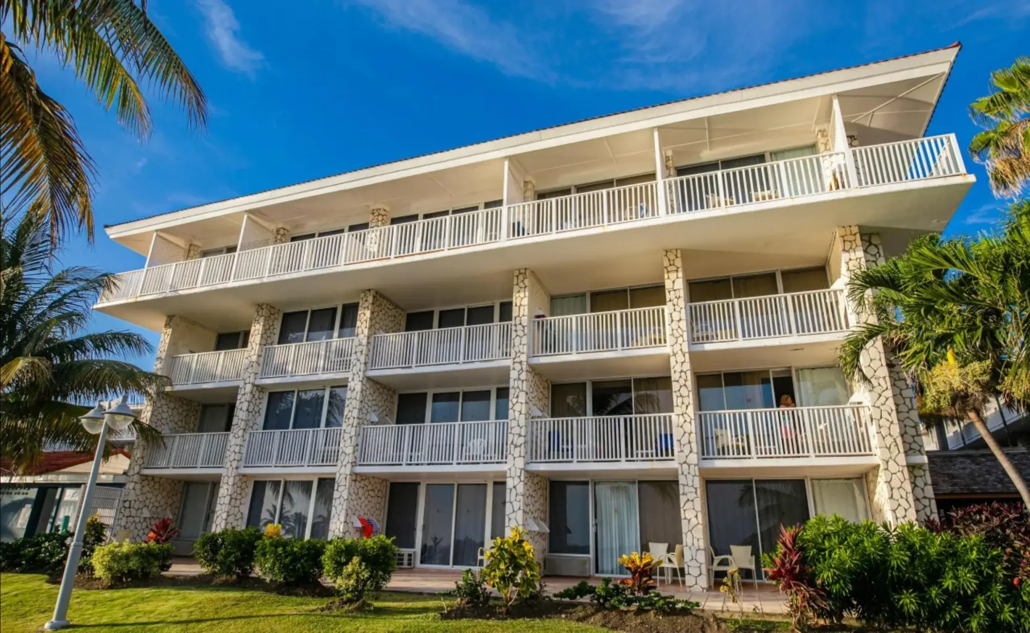 White multi-story suite exterior with private balconies at Catalonia Montego Bay, Montego Bay